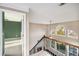 Upstairs hallway with view of a bedroom and staircase at 255 Southshore Ln, Dallas, GA 30157