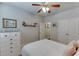 Bedroom with white dresser and ceiling fan at 6715 Country Lake Rd, Cumming, GA 30041