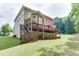 Two story house with large deck and backyard at 6715 Country Lake Rd, Cumming, GA 30041