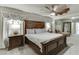 Main bedroom with large bed and ceiling fan at 6715 Country Lake Rd, Cumming, GA 30041