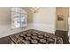 Dining room featuring hardwood floors, a patterned rug, and a large window at 1260 Lakehaven Pkwy, Mcdonough, GA 30253