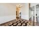 Formal dining room with dark hardwood floors, chandelier, and view into kitchen at 1260 Lakehaven Pkwy, Mcdonough, GA 30253