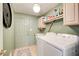 Laundry room with washer, dryer, and extra storage at 1260 Lakehaven Pkwy, Mcdonough, GA 30253