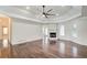 Spacious living room featuring hardwood floors, a fireplace, and a high ceiling with recessed lighting at 1260 Lakehaven Pkwy, Mcdonough, GA 30253