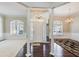 Spacious living room with hardwood floors, white columns, and a chandelier at 1260 Lakehaven Pkwy, Mcdonough, GA 30253