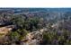 Aerial view showing a house surrounded by lush greenery at 2107 Penrose Dr, Atlanta, GA 30344