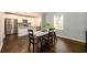 Dining area with hardwood floors and kitchen view at 2107 Penrose Dr, Atlanta, GA 30344