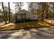 Charming house with gray siding, steps and a covered porch at 2107 Penrose Dr, Atlanta, GA 30344