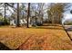 House exterior with a large yard and tree-lined street at 2107 Penrose Dr, Atlanta, GA 30344