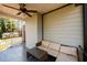 Covered porch with wicker furniture and ceiling fan at 2107 Penrose Dr, Atlanta, GA 30344