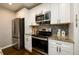 Modern kitchen with stainless steel appliances and granite countertops at 2107 Penrose Dr, Atlanta, GA 30344