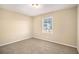 Bright bedroom with neutral walls and carpet flooring at 2343 Maryland Ct, Decatur, GA 30032