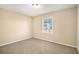 Cozy bedroom with neutral walls and carpet at 2343 Maryland Ct, Decatur, GA 30032