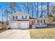 Two-story house with a two-car garage and landscaped yard at 2343 Maryland Ct, Decatur, GA 30032