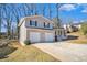 Two-story house with a two-car garage and driveway at 2343 Maryland Ct, Decatur, GA 30032