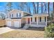 Two-story house with a two-car garage and covered porch at 2343 Maryland Ct, Decatur, GA 30032