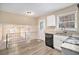 Modern kitchen featuring granite countertops and white cabinets at 2343 Maryland Ct, Decatur, GA 30032