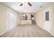 Bright living room with neutral carpeting and kitchen view at 2343 Maryland Ct, Decatur, GA 30032