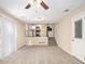 Bright living room with neutral carpeting and kitchen view at 2343 Maryland Ct, Decatur, GA 30032