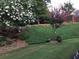 Landscaped backyard with blooming flowers and trees at 7570 Weston Club Dr, Suwanee, GA 30024