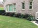 Landscaped backyard with hostas and shrubs at 7570 Weston Club Dr, Suwanee, GA 30024