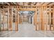 Unfinished basement with framed walls and concrete floor at 7570 Weston Club Dr, Suwanee, GA 30024