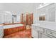 Bathroom with marble flooring, a soaking tub, and a walk-in shower at 7570 Weston Club Dr, Suwanee, GA 30024