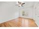 Bright bedroom with hardwood floors and ceiling fan at 7570 Weston Club Dr, Suwanee, GA 30024