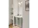 Small bathroom with gray vanity, floating shelves, and modern fixtures at 1237 Memorial Se Dr # 403, Atlanta, GA 30316