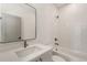 Modern bathroom with white subway tiles, quartz countertop, and a bathtub at 1237 Memorial Se Dr # 403, Atlanta, GA 30316