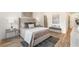 Main bedroom with plush bed, hardwood floors, and ample natural light at 1237 Memorial Se Dr # 403, Atlanta, GA 30316