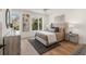 Bright bedroom featuring hardwood floors and large windows at 1237 Memorial Se Dr # 403, Atlanta, GA 30316