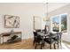 Bright dining room with hardwood floors, a chandelier, and large windows at 1237 Memorial Se Dr # 403, Atlanta, GA 30316