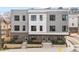 Modern three-unit townhome building with gray siding and brick accents at 1237 Memorial Se Dr # 403, Atlanta, GA 30316