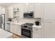 Modern kitchen with stainless steel appliances and white cabinets at 1237 Memorial Se Dr # 403, Atlanta, GA 30316
