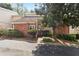 Charming brick townhome with inviting front entrance and mature landscaping for added curb appeal at 3036 Vinings Ferry Se Dr, Atlanta, GA 30339