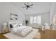 Bright main bedroom boasts wooden floors, ceiling fan and luxury appointments at 3036 Vinings Ferry Se Dr, Atlanta, GA 30339