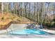 Community pool surrounded by mature trees providing a refreshing oasis for residents at 3036 Vinings Ferry Se Dr, Atlanta, GA 30339
