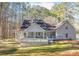 Spacious deck and private backyard with wooded surroundings at 3820 Mink Livsey Rd, Snellville, GA 30039