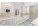 Large bathroom with double sinks, a bathtub, and a walk-in shower at 3820 Mink Livsey Rd, Snellville, GA 30039