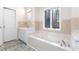 Bathroom with a bathtub and separate shower at 3820 Mink Livsey Rd, Snellville, GA 30039