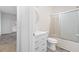 Clean bathroom with white vanity, toilet and tub/shower combo at 3820 Mink Livsey Rd, Snellville, GA 30039