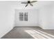 Bright bedroom with carpet, ceiling fan and ample closet space at 3820 Mink Livsey Rd, Snellville, GA 30039