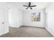 Spacious bedroom with carpet, large window, and ceiling fan at 3820 Mink Livsey Rd, Snellville, GA 30039
