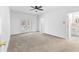 Spacious bedroom with carpet, ceiling fan, and access to a private balcony at 3820 Mink Livsey Rd, Snellville, GA 30039
