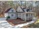 Gray house with attached garage and large deck at 3820 Mink Livsey Rd, Snellville, GA 30039