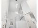 Two story foyer with an open staircase and modern light fixture at 3820 Mink Livsey Rd, Snellville, GA 30039