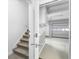 Stairs leading to garage with built-in storage at 3820 Mink Livsey Rd, Snellville, GA 30039