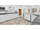Open kitchen with white cabinets, granite countertops, and a large window at 3820 Mink Livsey Rd, Snellville, GA 30039