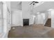 Large living room with high ceilings, carpet, and fireplace at 3820 Mink Livsey Rd, Snellville, GA 30039